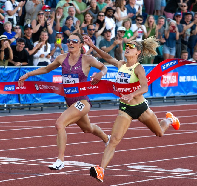 Elle St. Pierre, right, edges out Elise Cranny for gold in the women’s 5,000 meters during day four of the U.S. Olympic Track & Field Trials Monday, June 24, 2024, at Hayward Field in Eugene.
