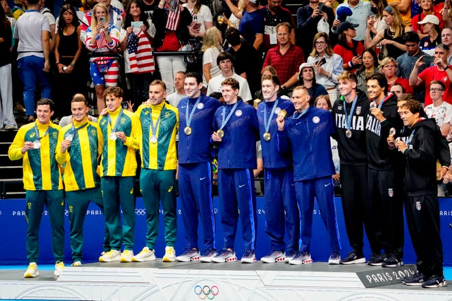 Australia, USA and Italy in the men’s 4 x 100-meter freestyle relay medal ceremony during the Paris 2024 Olympic Summer Games at Paris La Défense Arena.