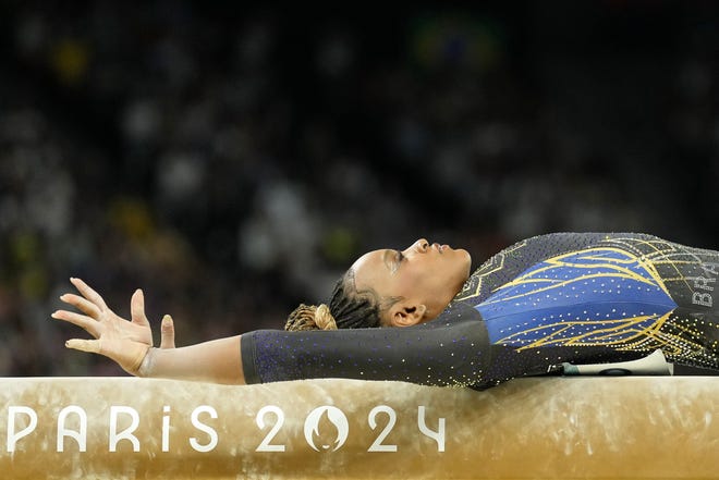 Rebeca Andrade of Brazil performs on the beam in womenÕs qualification during the Paris 2024 Olympic Summer Games at Bercy Arena.